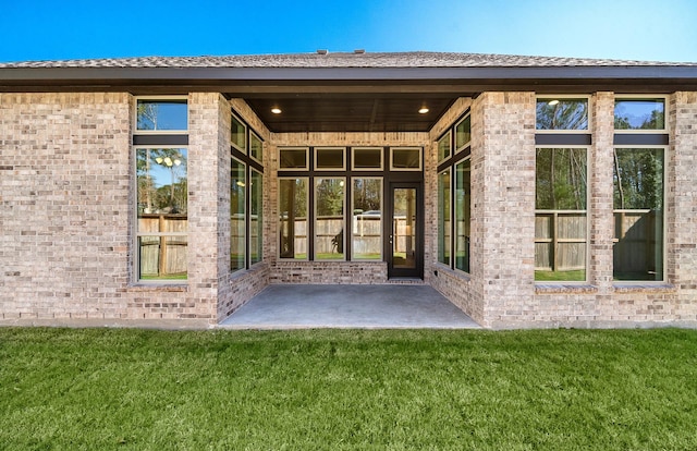 8215 Mount Washburn Ln, Porter, TX 77365 - back of house featuring a patio area and a lawn