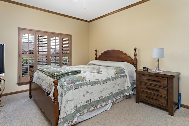 bedroom with a ceiling fan, carpet flooring, baseboards, and ornamental molding
