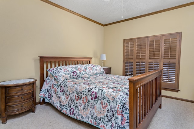carpeted bedroom featuring baseboards, a textured ceiling, and crown molding