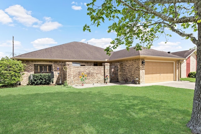 single story home with a front yard, fence, brick siding, a garage, and driveway