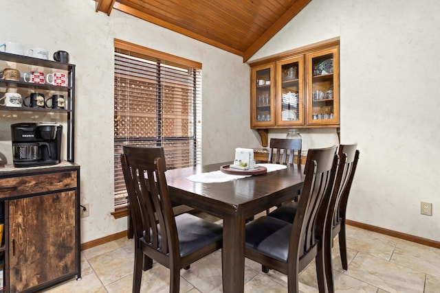 dining room with baseboards, light tile patterned flooring, vaulted ceiling, and wood ceiling