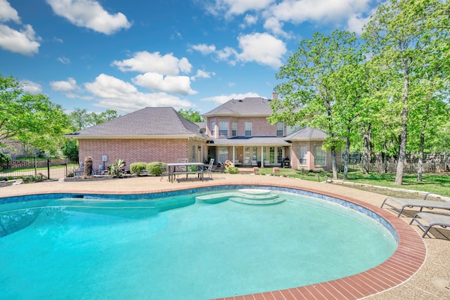 view of pool with a fenced in pool, a patio, and fence