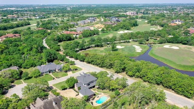 aerial view featuring golf course view, a residential view, and a water view