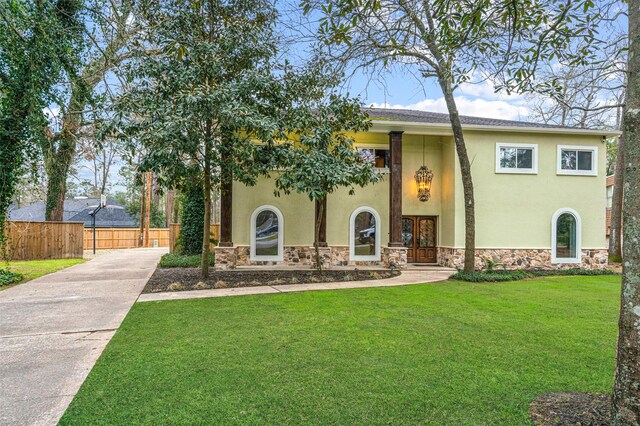 533 Rapidan Park, Conroe, TX 77302 - view of front of property with stone siding, french doors, stucco siding, and concrete driveway