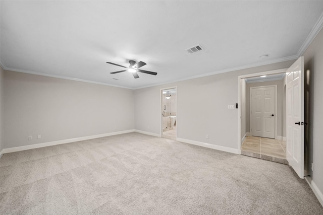 unfurnished room with visible vents, light colored carpet, baseboards, and ceiling fan