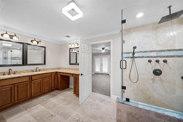 bathroom with a shower stall, vanity, crown molding, and ceiling fan