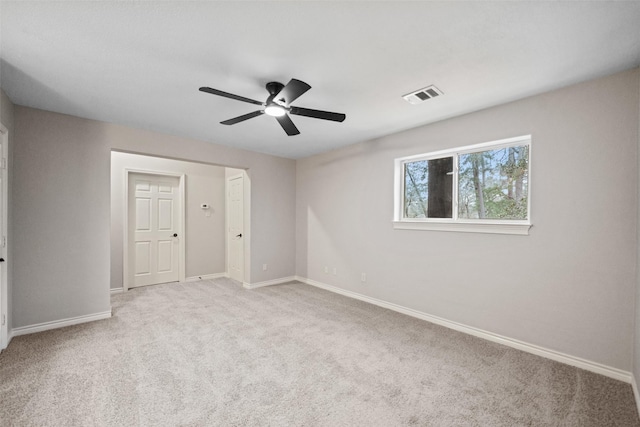 unfurnished bedroom with visible vents, baseboards, ceiling fan, and carpet