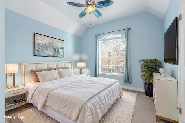 bedroom featuring light carpet, ceiling fan, baseboards, and lofted ceiling