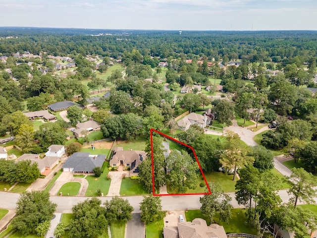 aerial view with a wooded view and a residential view