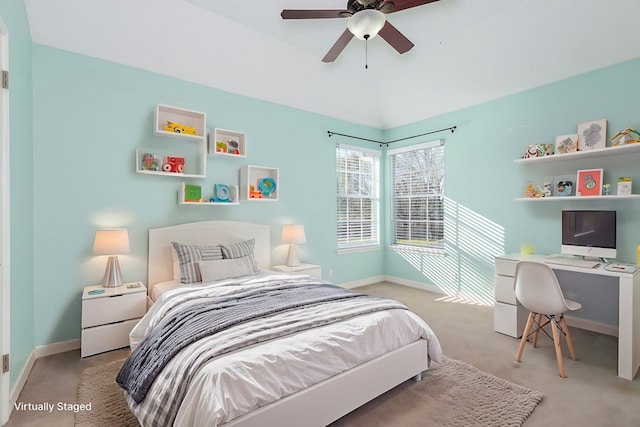 bedroom with baseboards, ceiling fan, light colored carpet, and lofted ceiling