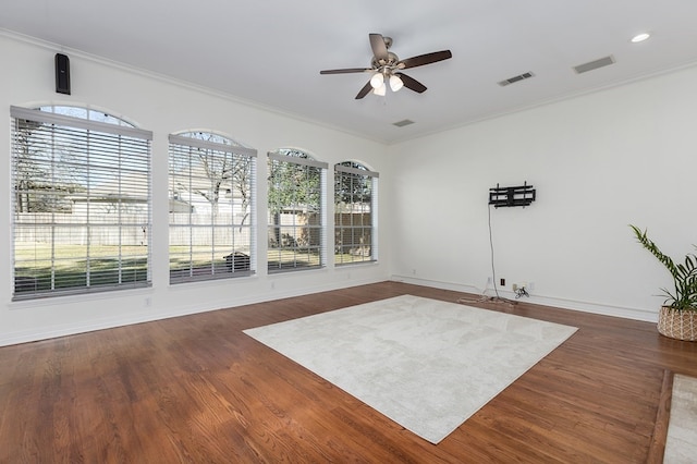 unfurnished room featuring visible vents, a wealth of natural light, and ceiling fan