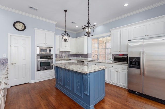 kitchen featuring visible vents, a notable chandelier, appliances with stainless steel finishes, white cabinetry, and blue cabinets