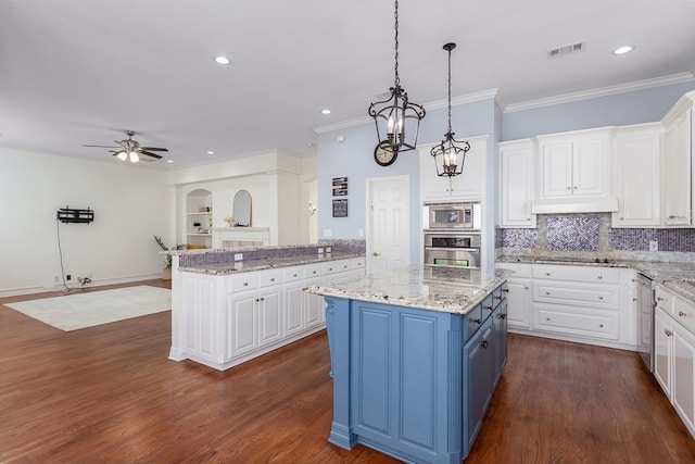 kitchen featuring white cabinetry, a kitchen island, under cabinet range hood, stainless steel appliances, and blue cabinets
