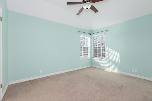 empty room with carpet flooring, baseboards, and ceiling fan