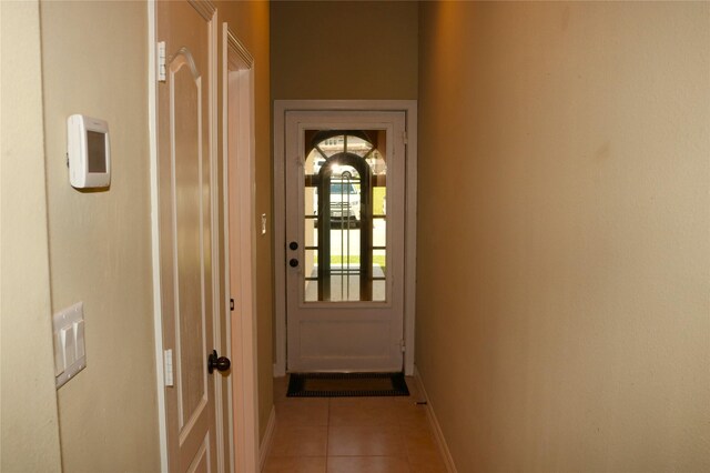 17 Regency Pt, Conroe, TX 77356 - doorway to outside with light tile patterned floors and baseboards