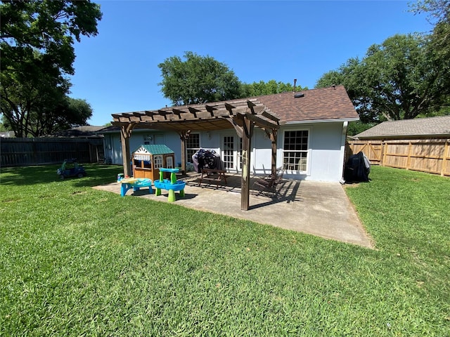 back of property with a pergola, a yard, a fenced backyard, stucco siding, and a patio