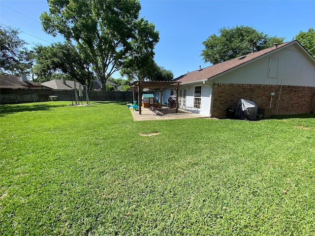 view of yard with a fenced backyard, a pergola, and a patio