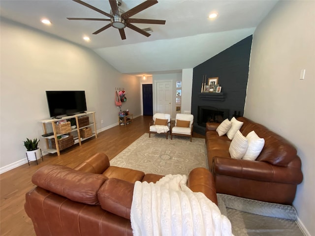 living room featuring a ceiling fan, recessed lighting, wood finished floors, lofted ceiling, and baseboards