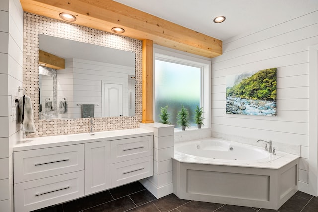 bathroom featuring recessed lighting, a bath, tile patterned flooring, and vanity