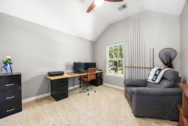 office featuring ceiling fan, vaulted ceiling, carpet flooring, and visible vents