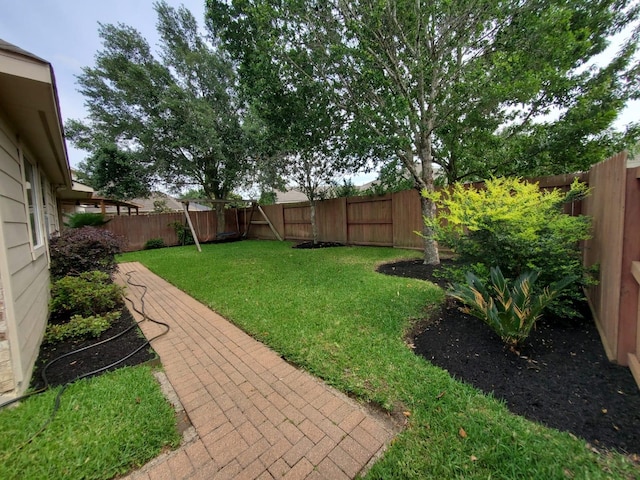 view of yard featuring a fenced backyard