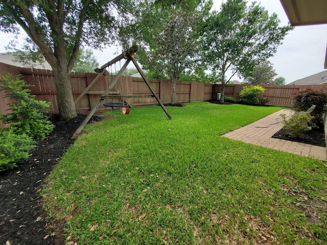view of yard with a fenced backyard