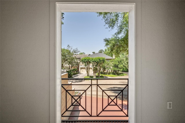entryway with a textured wall and plenty of natural light