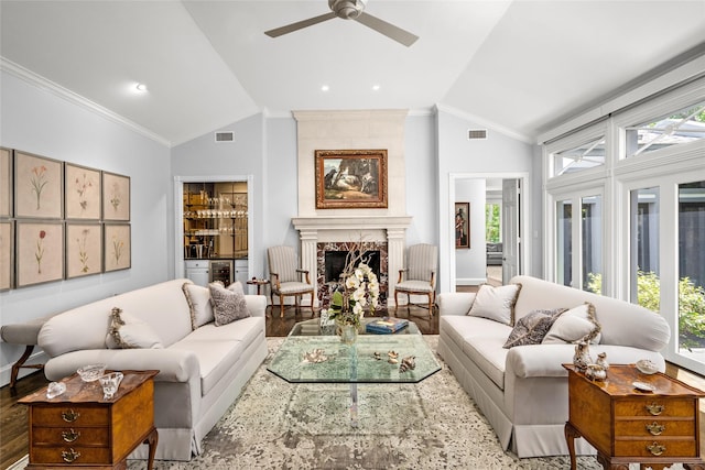 living room featuring wood finished floors, ceiling fan, visible vents, and high vaulted ceiling
