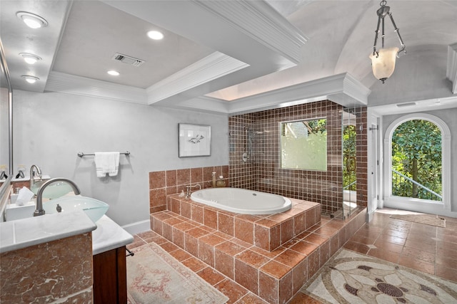 full bathroom featuring vanity, baseboards, ornamental molding, visible vents, and a garden tub