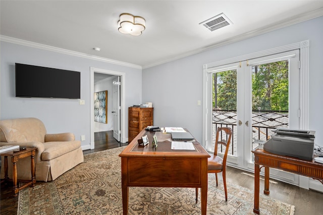office space featuring crown molding, visible vents, wood finished floors, french doors, and baseboards