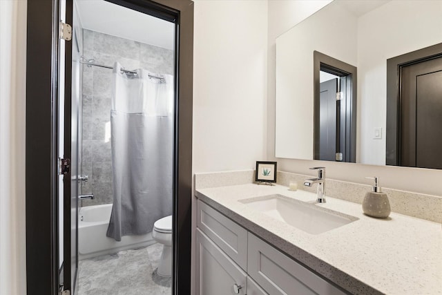 bathroom with toilet, shower / tub combo, and vanity