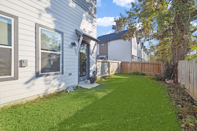 view of yard with a fenced backyard
