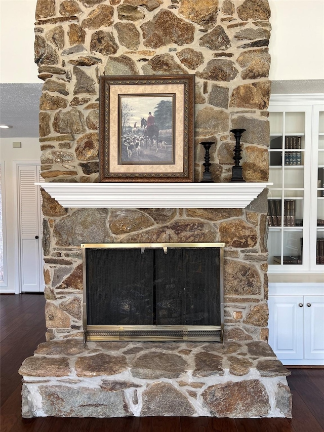 1809 Hawthorn Dr, Richmond, TX 77469 - room details featuring a stone fireplace and wood finished floors