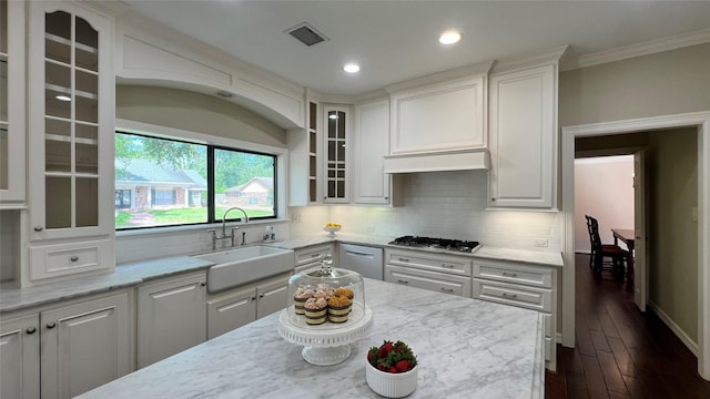 1809 Hawthorn Dr, Richmond, TX 77469 - kitchen featuring ornamental molding, white cabinets, visible vents, stainless steel gas stovetop, and a sink