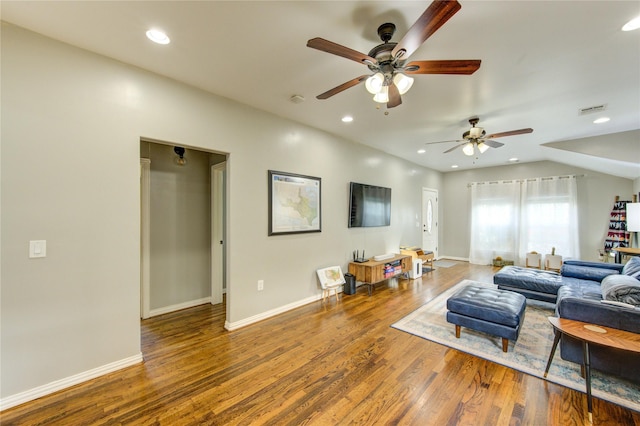 living area with a ceiling fan, wood finished floors, baseboards, and recessed lighting