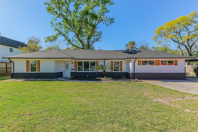 ranch-style house featuring brick siding, a front lawn, and fence