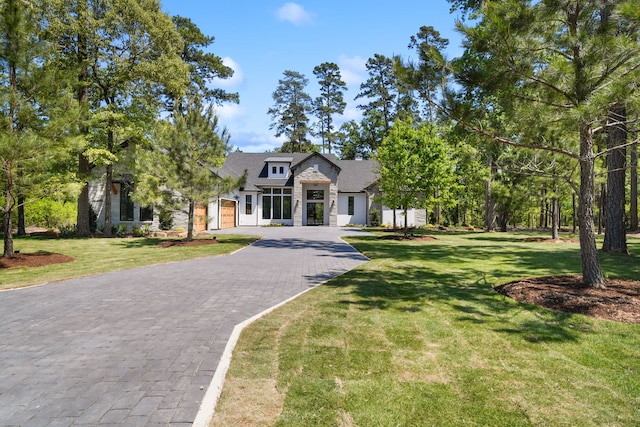 4458 Lily Bean, Montgomery, TX 77316 - view of front facade featuring a front yard and decorative driveway