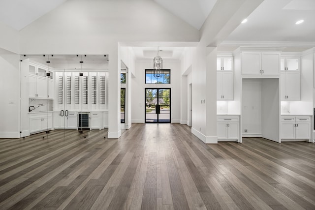 4458 Lily Bean, Montgomery, TX 77316 - unfurnished living room featuring a chandelier, recessed lighting, baseboards, and dark wood finished floors