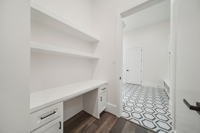 4458 Lily Bean, Montgomery, TX 77316 - unfurnished office with built in desk and dark wood-type flooring