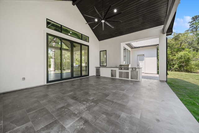 4458 Lily Bean, Montgomery, TX 77316 - view of patio featuring a grill, an outdoor kitchen, and a ceiling fan
