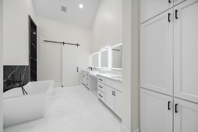 4458 Lily Bean, Montgomery, TX 77316 - bathroom with visible vents, a soaking tub, vanity, tile patterned floors, and high vaulted ceiling