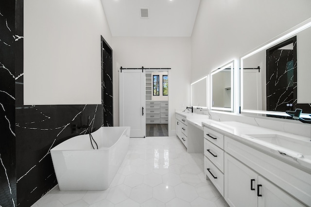 4458 Lily Bean, Montgomery, TX 77316 - full bath with a freestanding tub, visible vents, tile patterned floors, and vanity