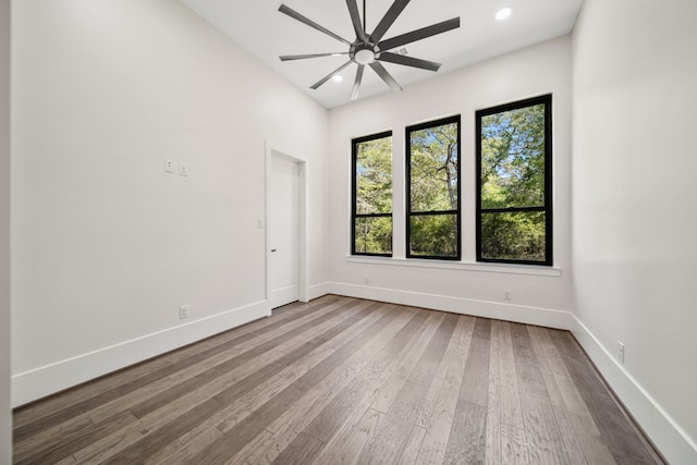 4458 Lily Bean, Montgomery, TX 77316 - unfurnished room featuring a ceiling fan, wood finished floors, and a healthy amount of sunlight
