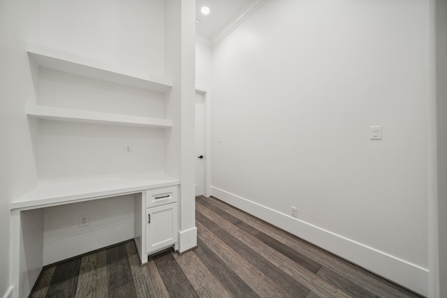 4458 Lily Bean, Montgomery, TX 77316 - unfurnished office featuring dark wood-type flooring, built in desk, baseboards, and ornamental molding