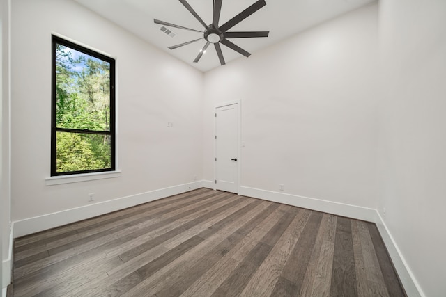 4458 Lily Bean, Montgomery, TX 77316 - spare room with wood finished floors, ceiling fan, and baseboards