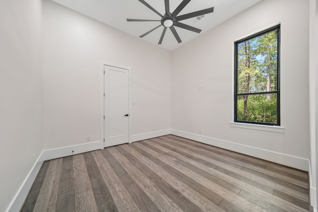 4458 Lily Bean, Montgomery, TX 77316 - empty room featuring visible vents, ceiling fan, wood finished floors, and baseboards