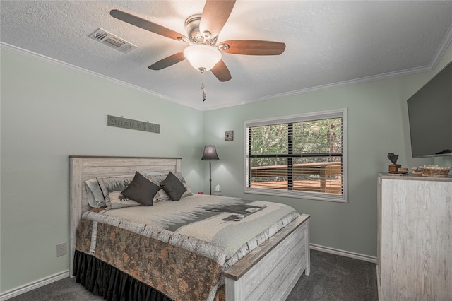 bedroom with baseboards, dark colored carpet, and visible vents