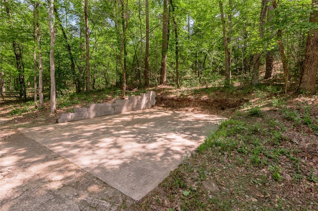 view of patio / terrace featuring a forest view