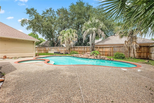 view of swimming pool with a patio, an in ground hot tub, a fenced backyard, and a fenced in pool