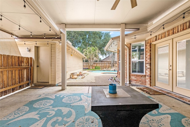 view of patio featuring french doors, a fenced in pool, and a fenced backyard